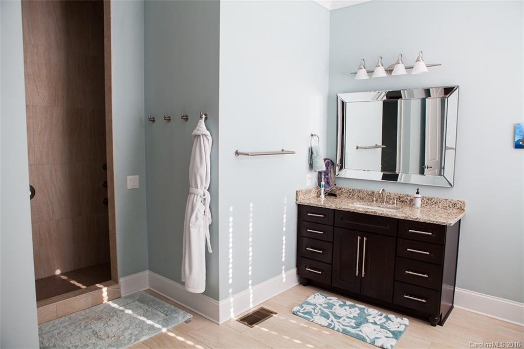 792 Harvest Pointe Drive Fort Mill, SC 29708 - Photo 16 of 24 a bathroom with a granite countertop sink a mirror and a shower