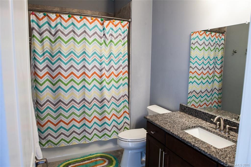 792 Harvest Pointe Drive Fort Mill, SC 29708 - Photo 24 of 24 a bathroom with a granite countertop toilet and a sink