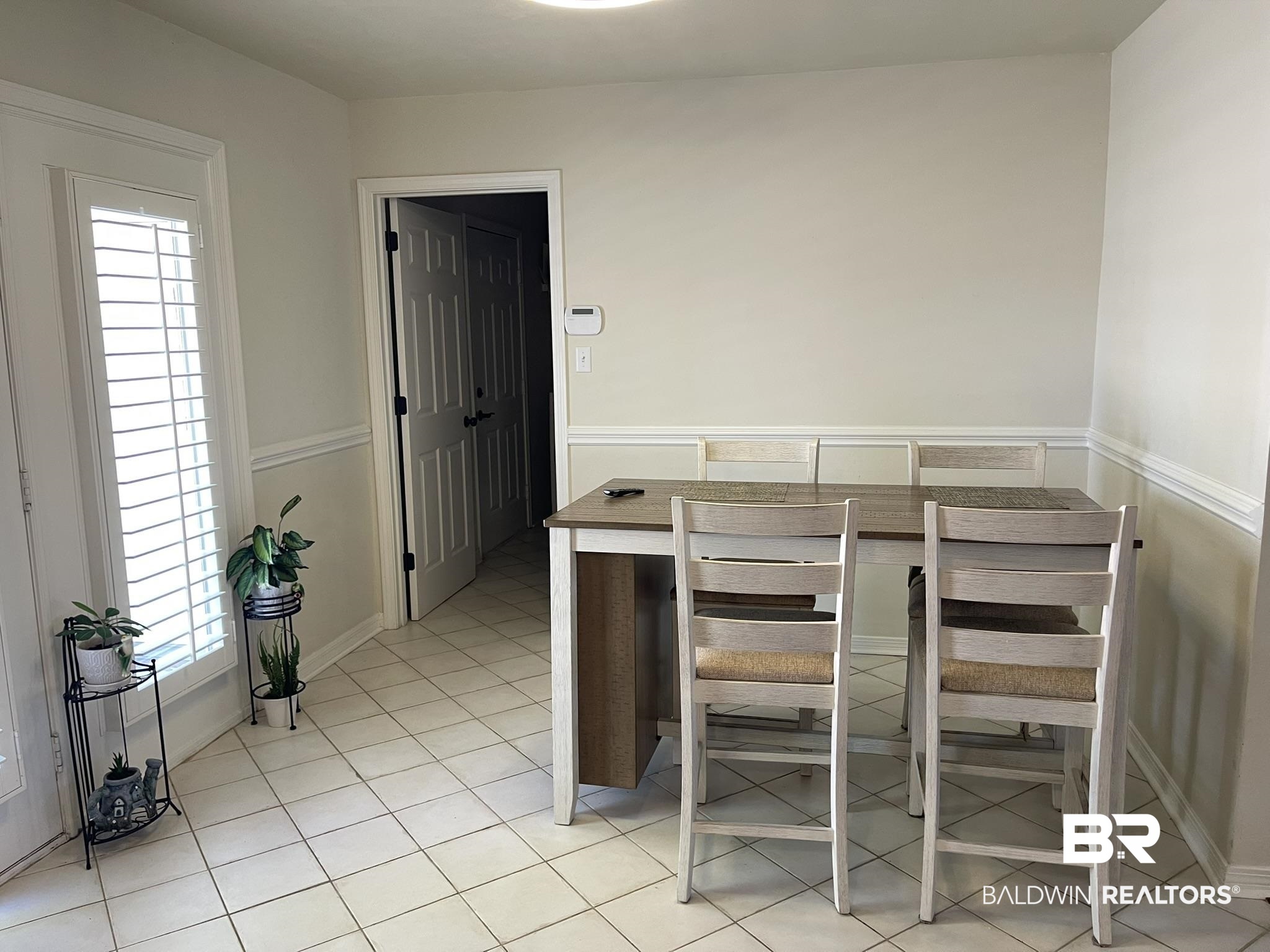 35405 Pine Road South Stapleton, AL 36578 - Photo 12 of 29 Dining space featuring light tile patterned flooring and baseboards