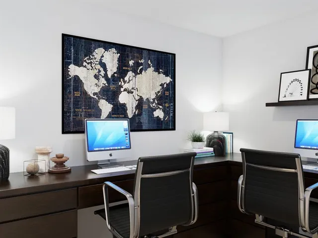 a view of a room with furniture and window