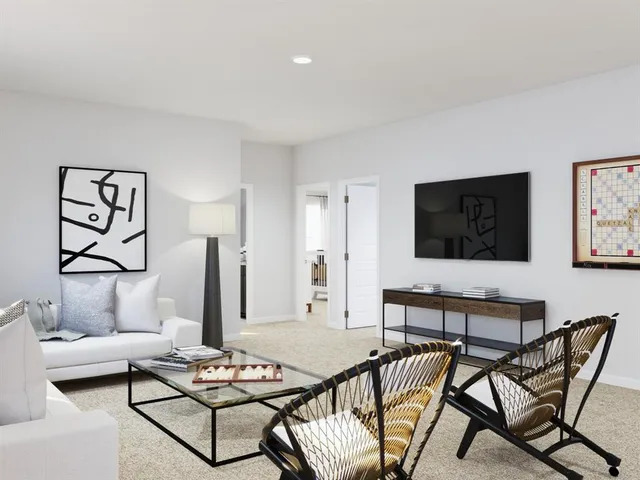 a living room with furniture and a couch