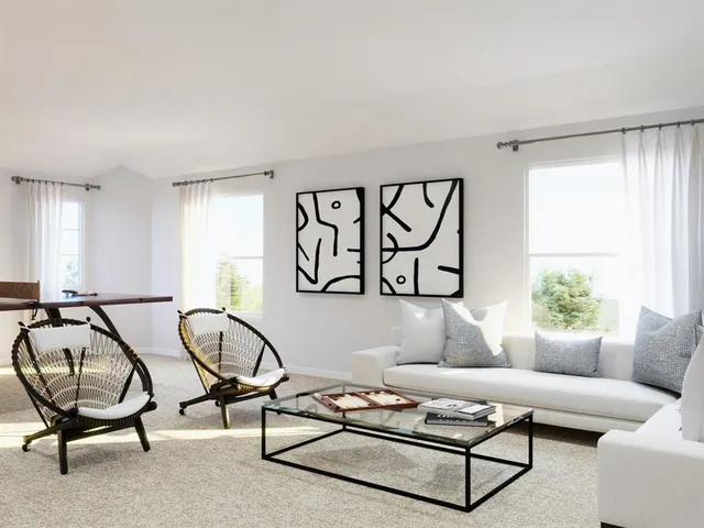 a bedroom with a bed and a potted plant