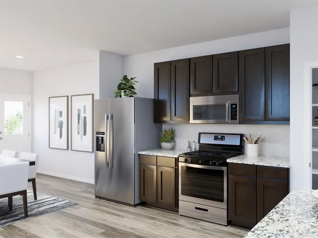 a kitchen with a table and chairs in it