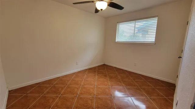 an empty room with a empty space and a window