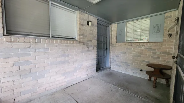 a bathroom with a shower and a sink