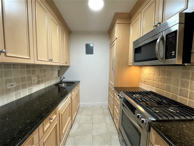a kitchen with a stove and a microwave