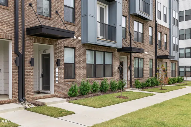 a view of a building with a yard