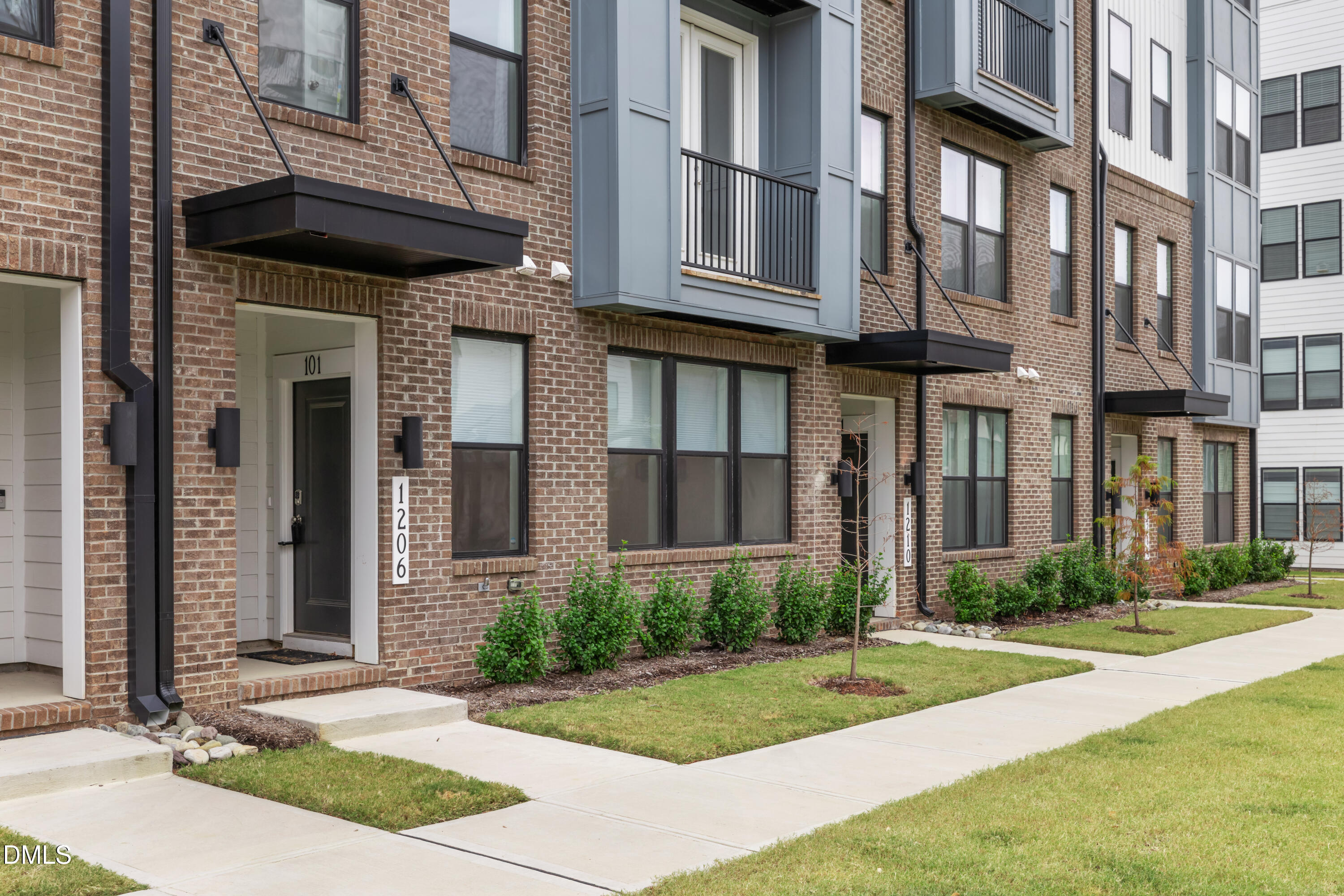 a view of a building with a yard