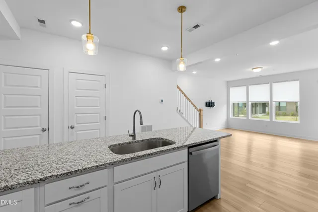 a kitchen with sink and window