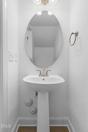 a bathroom with a sink and mirror