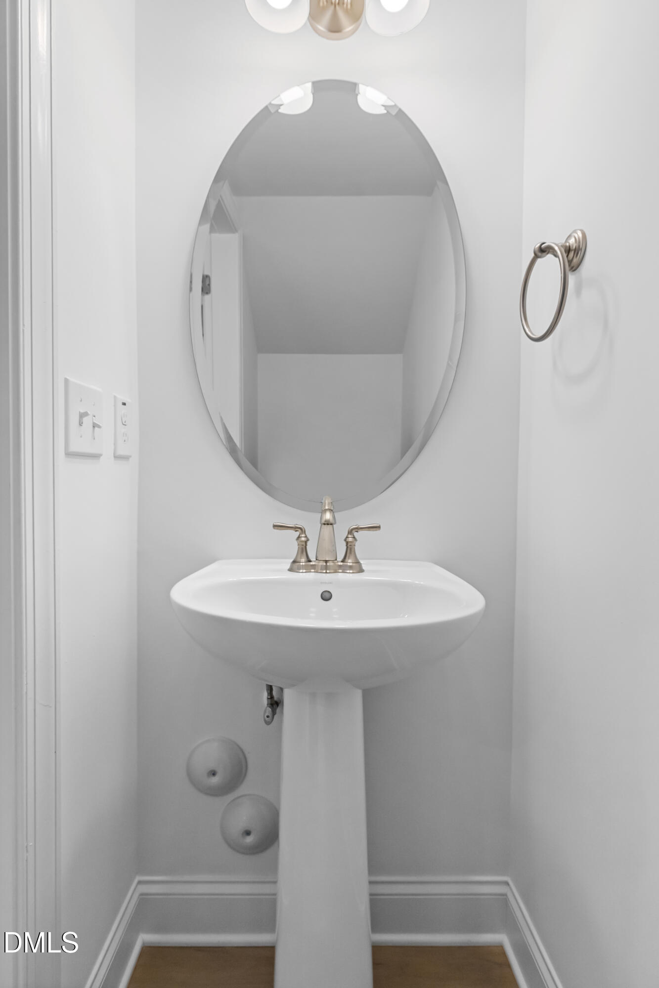 1206 Coach Station Alley Raleigh, NC 27601 - Photo 17 of 38 a bathroom with a sink and mirror