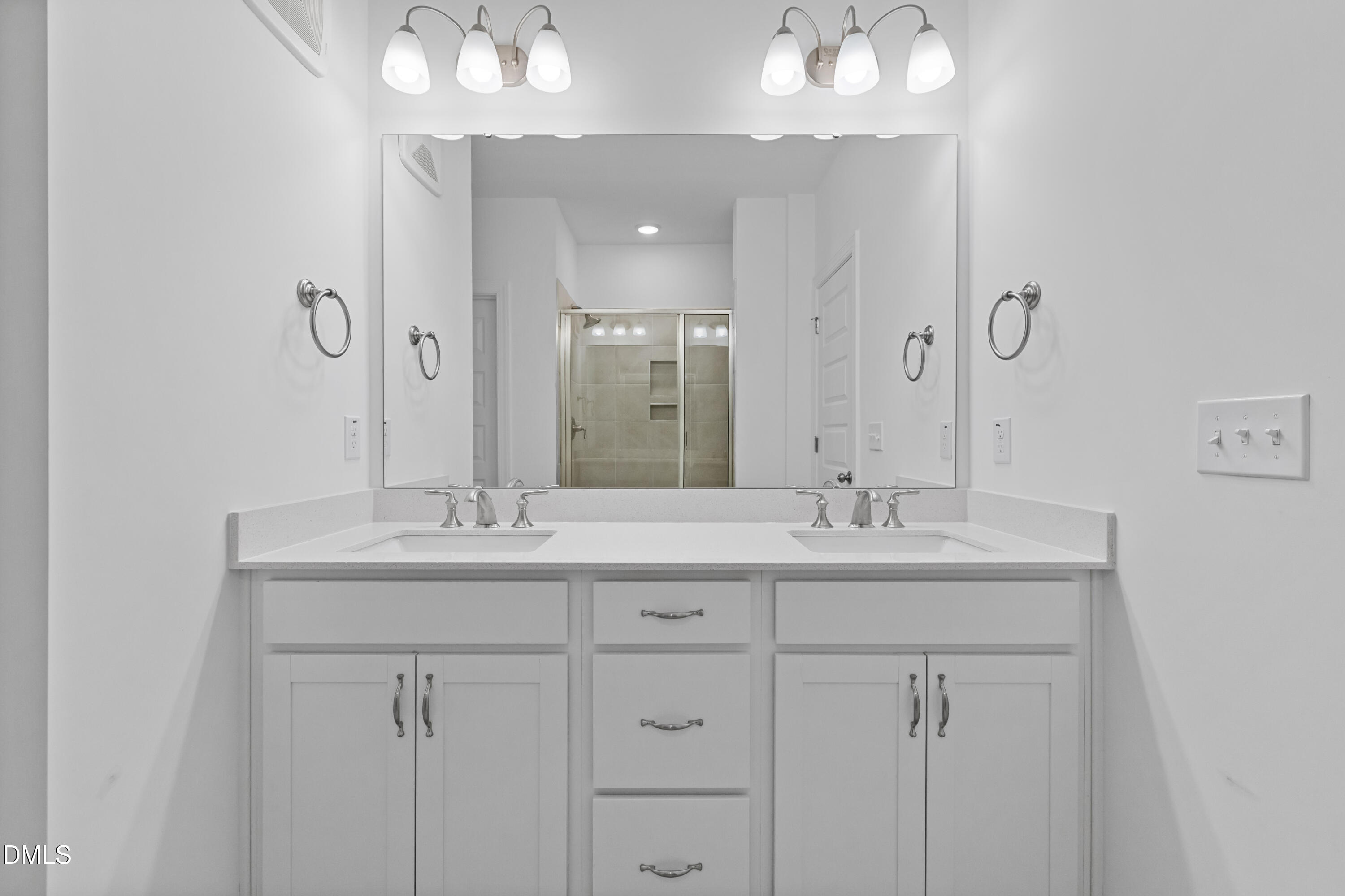 1206 Coach Station Alley Raleigh, NC 27601 - Photo 24 of 38 a bathroom with double sink and a mirror