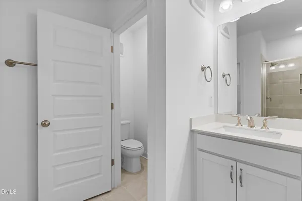 a bathroom with a glass shower door
