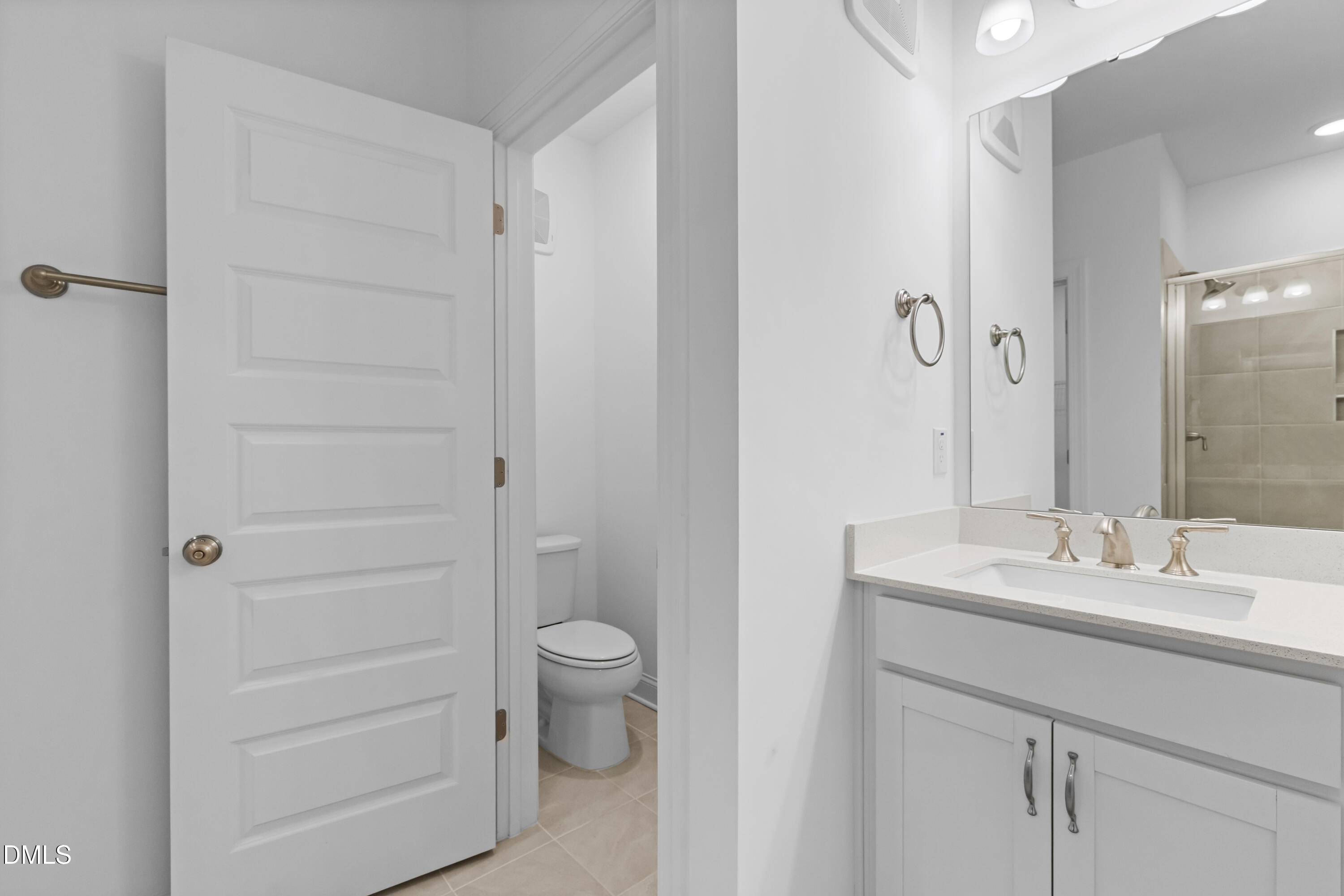 1206 Coach Station Alley Raleigh, NC 27601 - Photo 25 of 38 a bathroom with a sink a toilet and shower