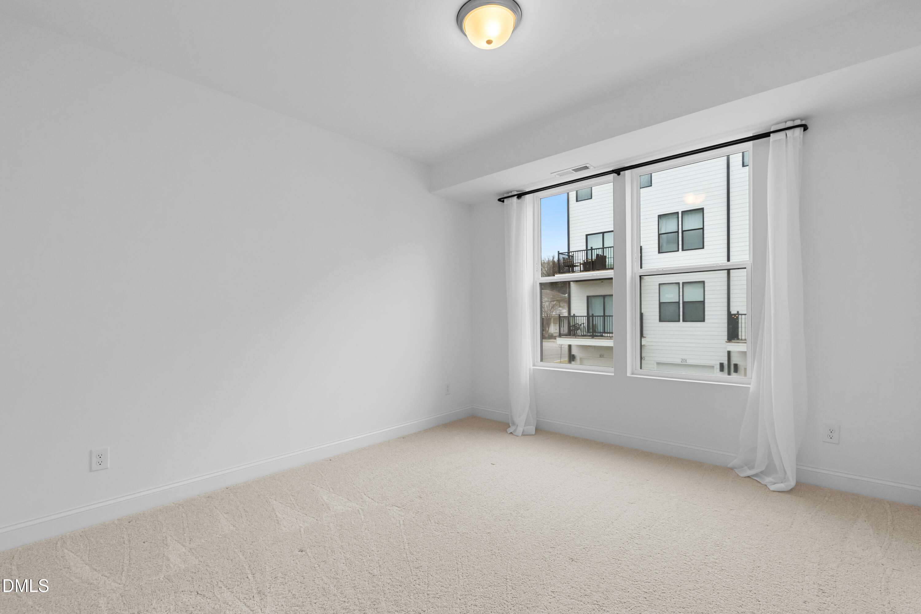 1206 Coach Station Alley Raleigh, NC 27601 - Photo 28 of 38 an empty room with a window