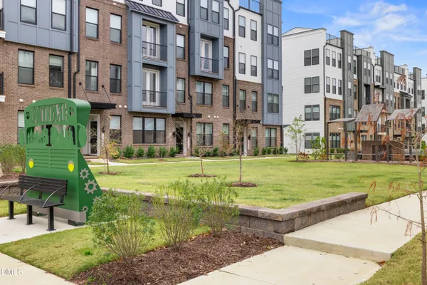 a view of an house with backyard porch and sitting area