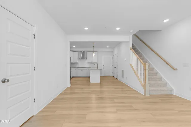 a view of kitchen with wooden floor and electronic appliances