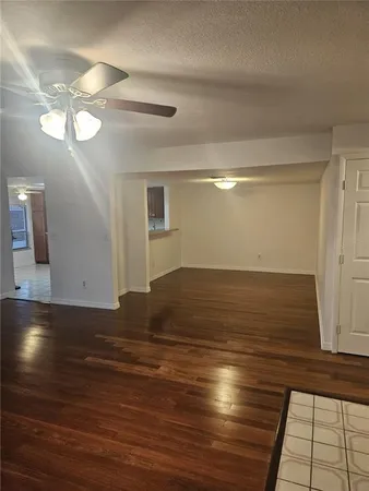 a view of room with wooden floor