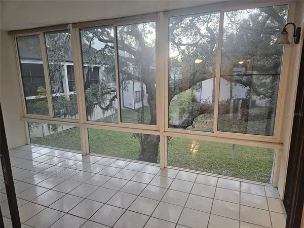 a view of a porch with a floor to ceiling window