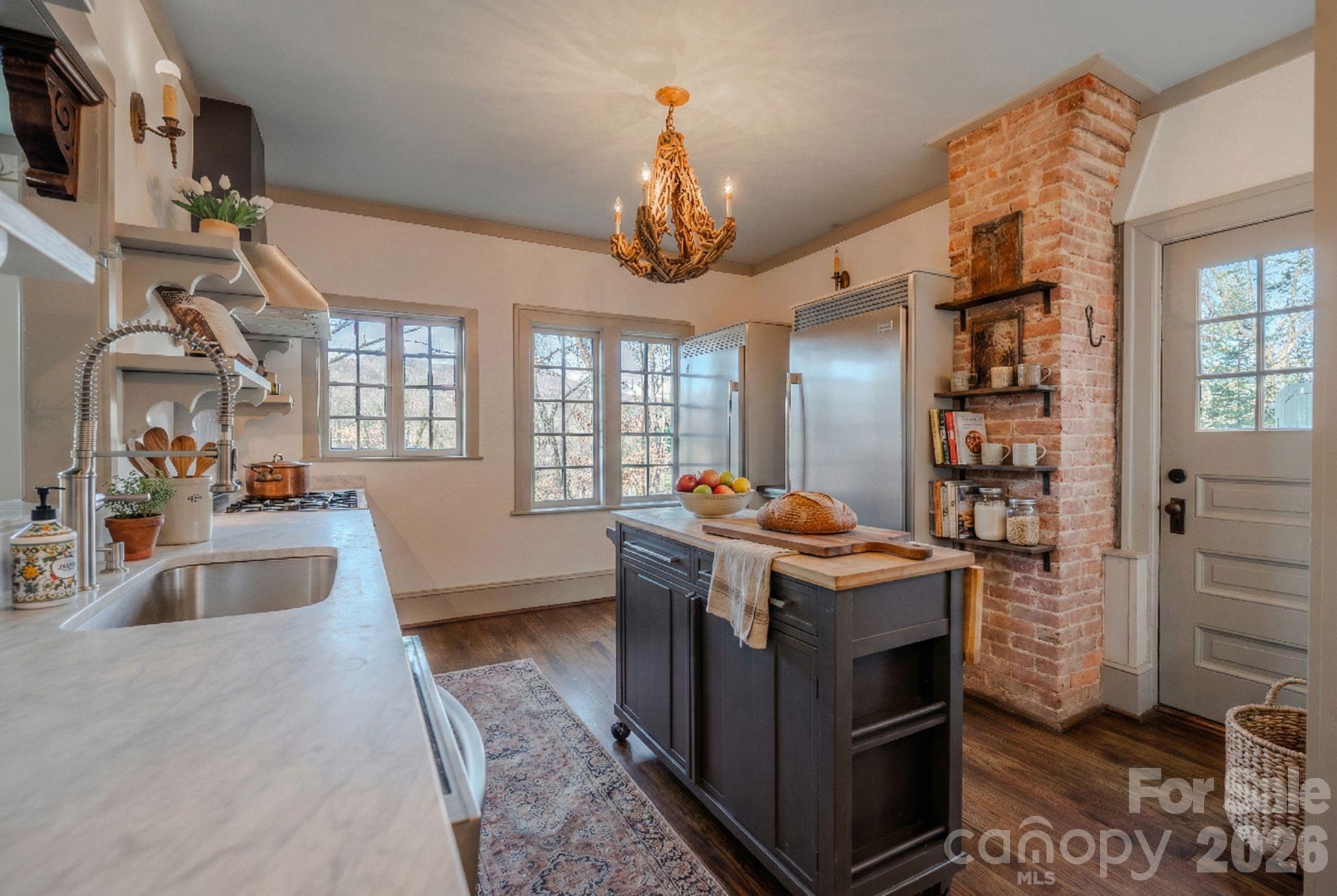 66 Fox Trot Lane Tryon, NC 28782 - Photo 15 of 48 a kitchen with stainless steel appliances granite countertop a stove and a sink