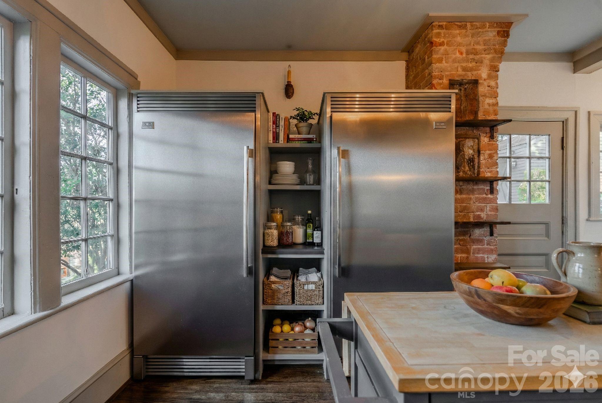 66 Fox Trot Lane Tryon, NC 28782 - Photo 18 of 48 a kitchen with stainless steel appliances granite countertop a refrigerator and a wooden floor