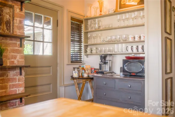 a room with a table and chairs
