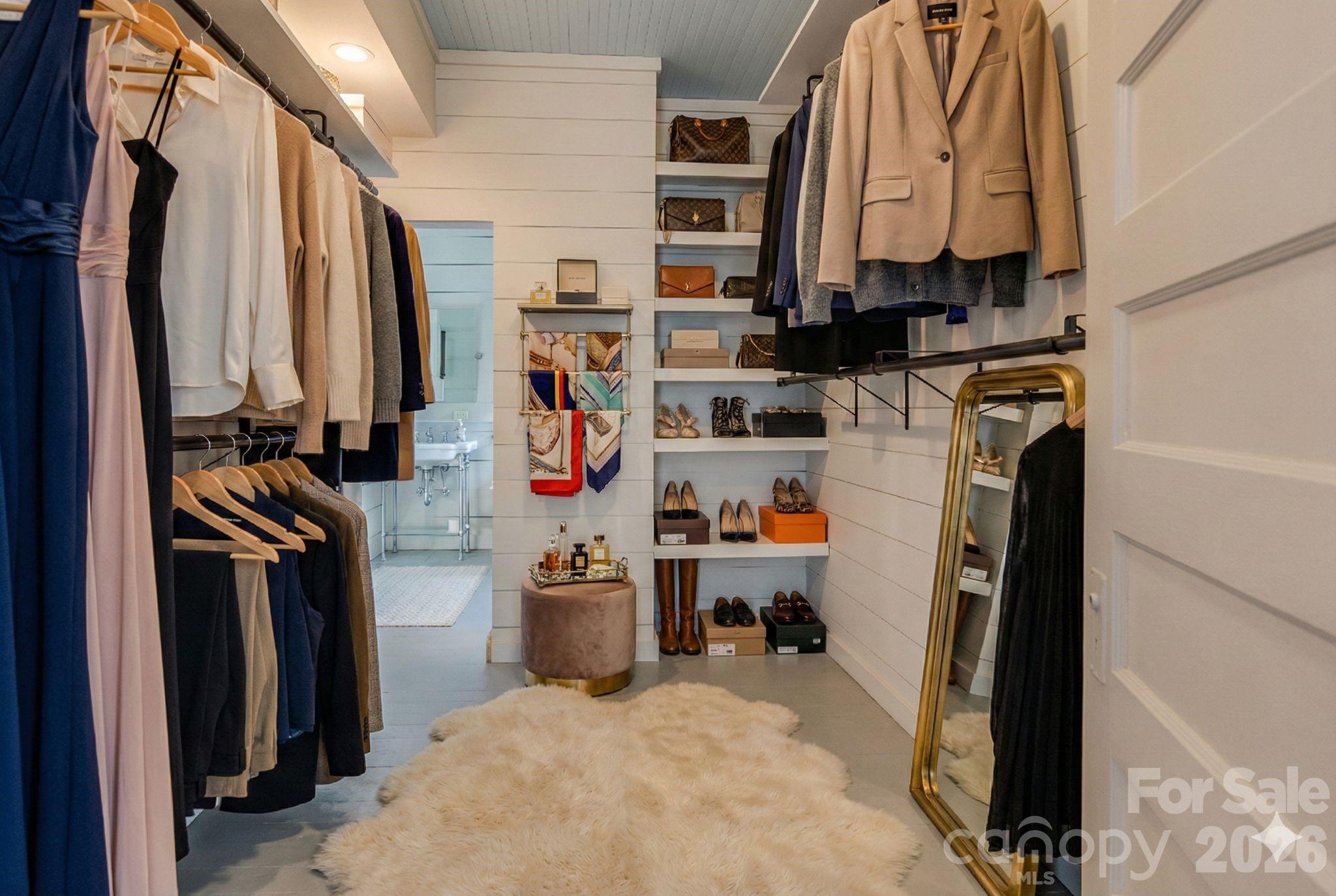 66 Fox Trot Lane Tryon, NC 28782 - Photo 22 of 48 a view of walk in closet with clothes and shoes