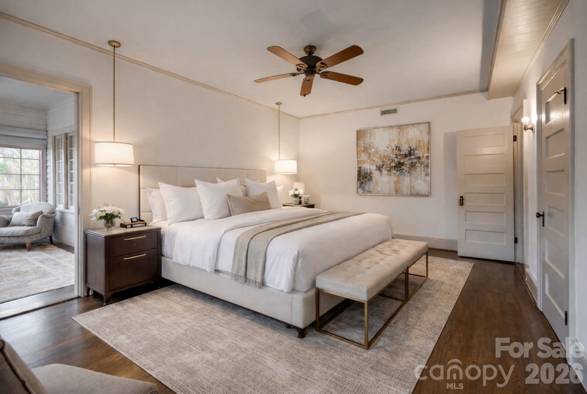 66 Fox Trot Lane Tryon, NC 28782 - Photo 25 of 48 a spacious bedroom with a bed and painting on the wall