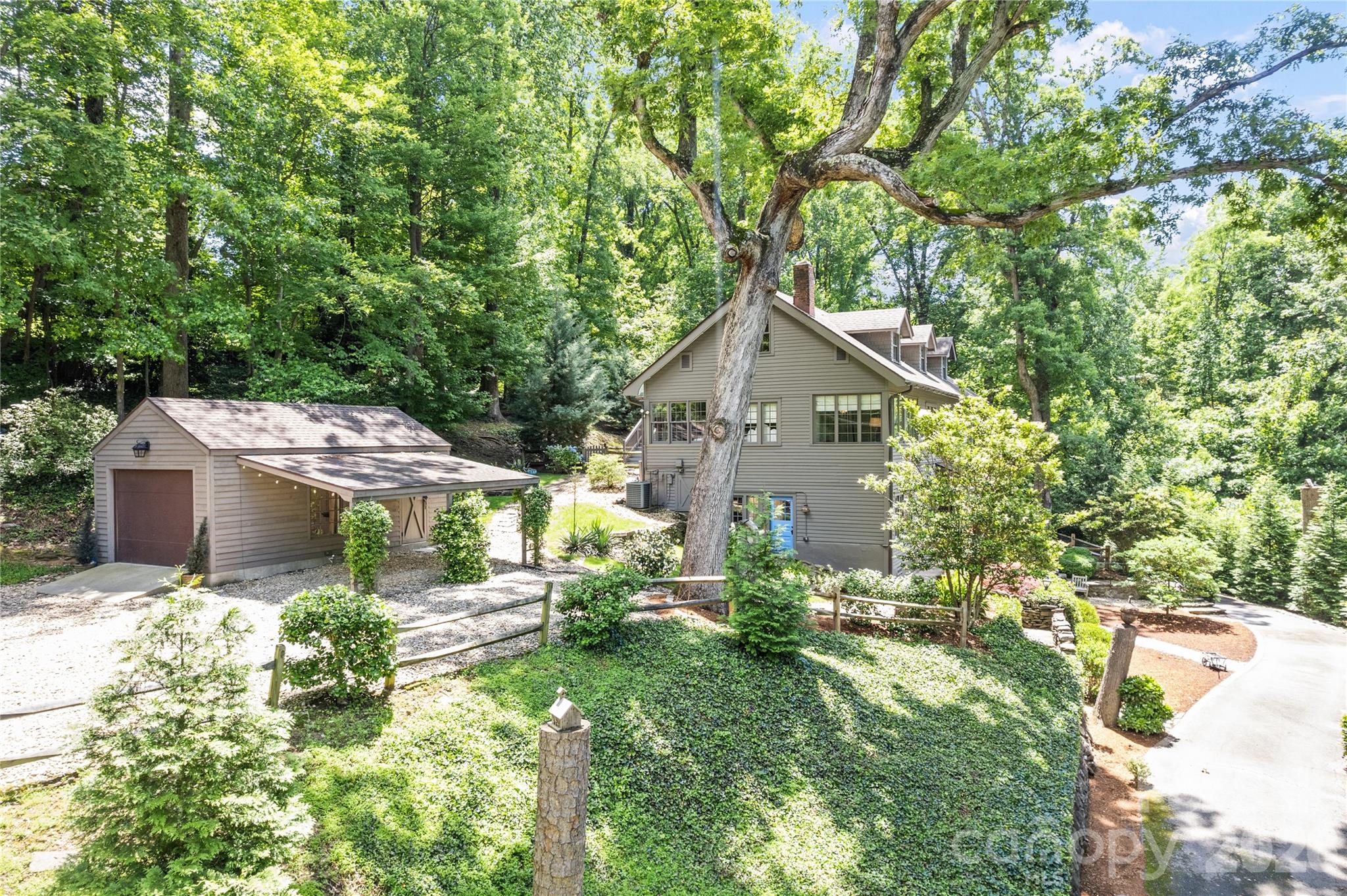 66 Fox Trot Lane Tryon, NC 28782 - Photo 3 of 48 a house view with a garden space