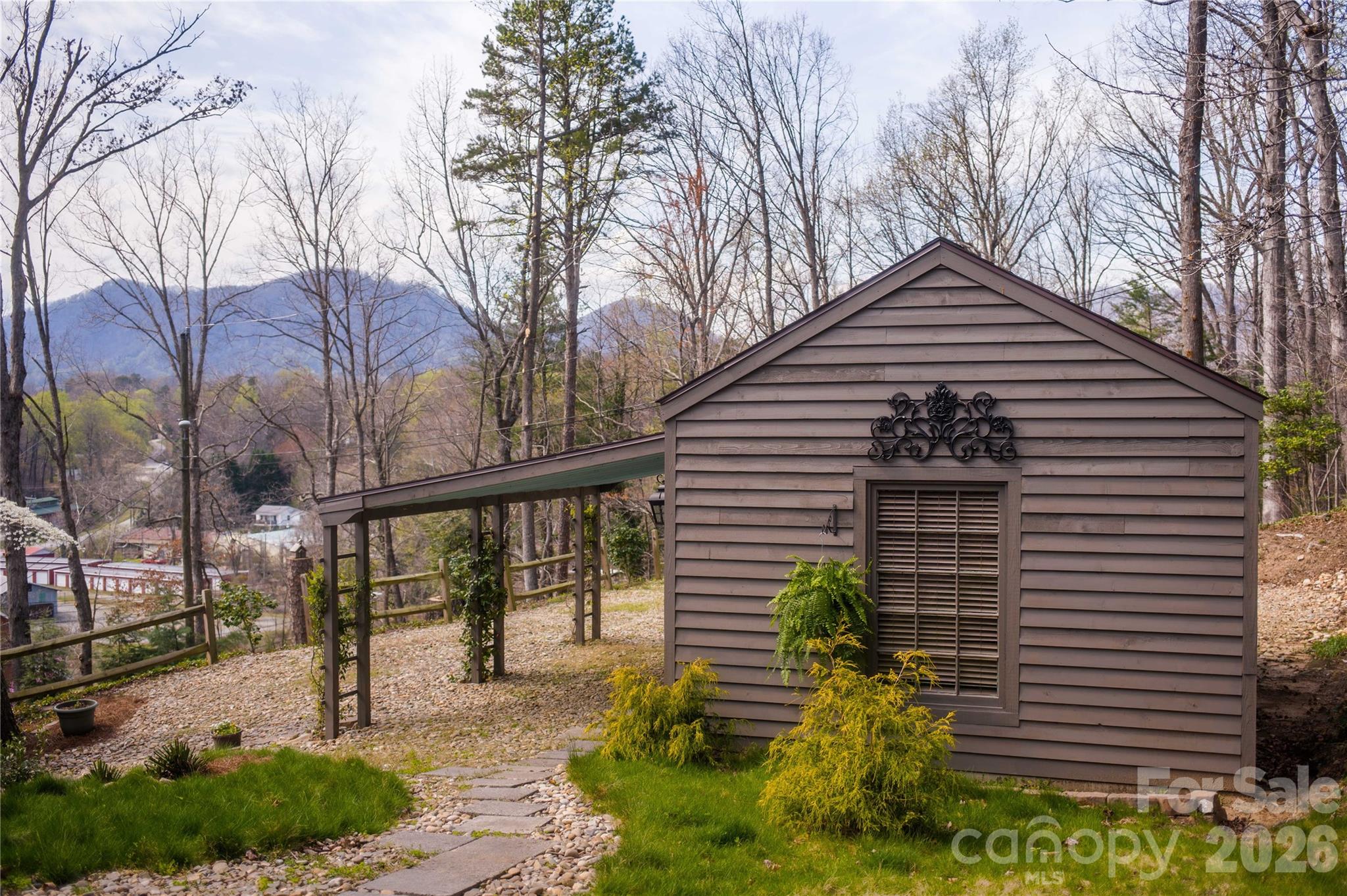 66 Fox Trot Lane Tryon, NC 28782 - Photo 4 of 48 a front view of a house with garden