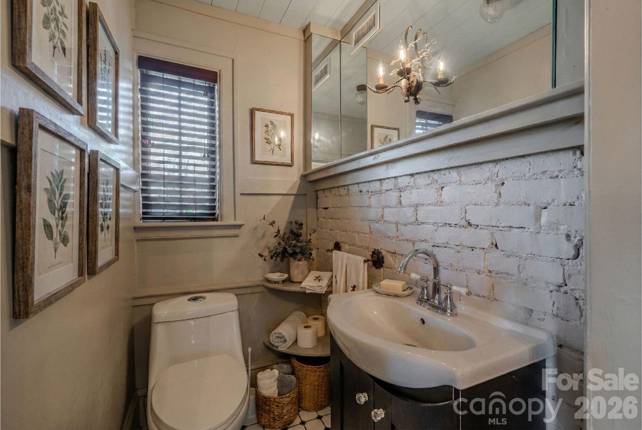 66 Fox Trot Lane Tryon, NC 28782 - Photo 42 of 48 a bathroom with a sink a toilet and mirror