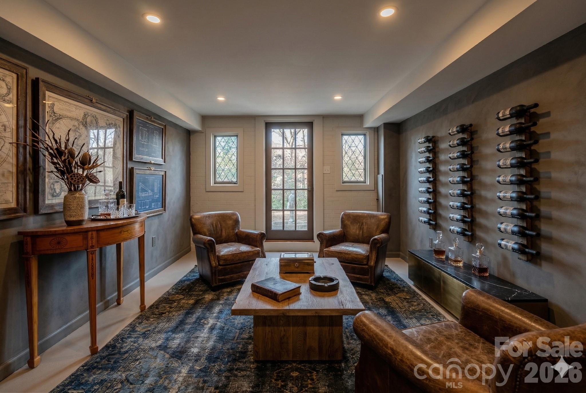 66 Fox Trot Lane Tryon, NC 28782 - Photo 43 of 48 a living room with furniture and a floor to ceiling window