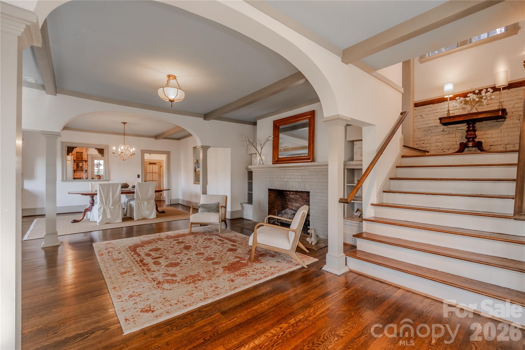 66 Fox Trot Lane Tryon, NC 28782 - Photo 10 of 48 a view of a livingroom with wooden floor and a fireplace