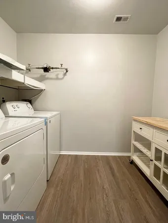 a view of storage and utility room with washer and dryer