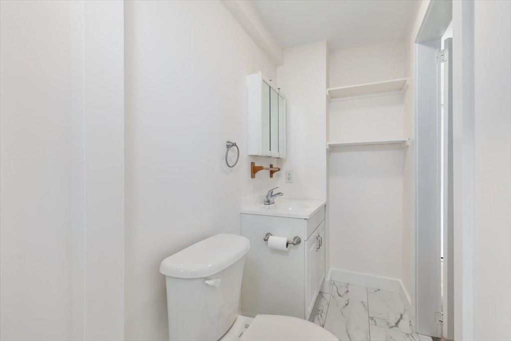 7 Cox Court Beverly, MA 01915 - Photo 12 of 23 a bathroom with a sink a toilet and shower