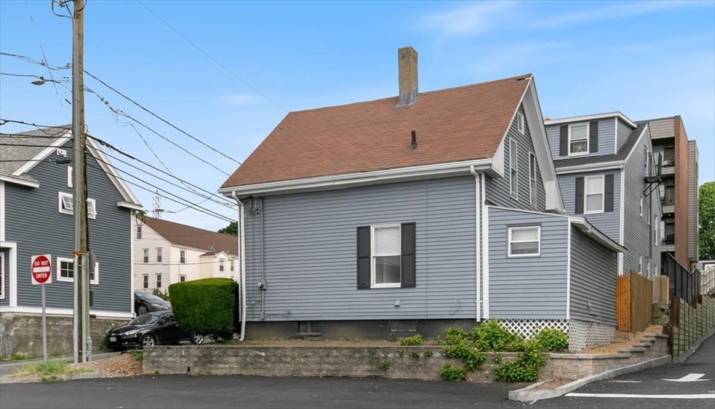 7 Cox Court Beverly, MA 01915 - Photo 21 of 23 a view of a house with a yard and plants