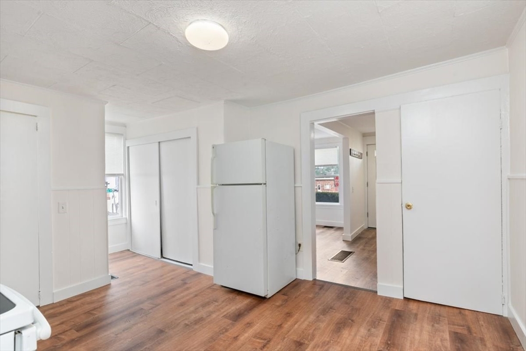 7 Cox Court Beverly, MA 01915 - Photo 7 of 23 a view of a room with wooden floor closet and windows
