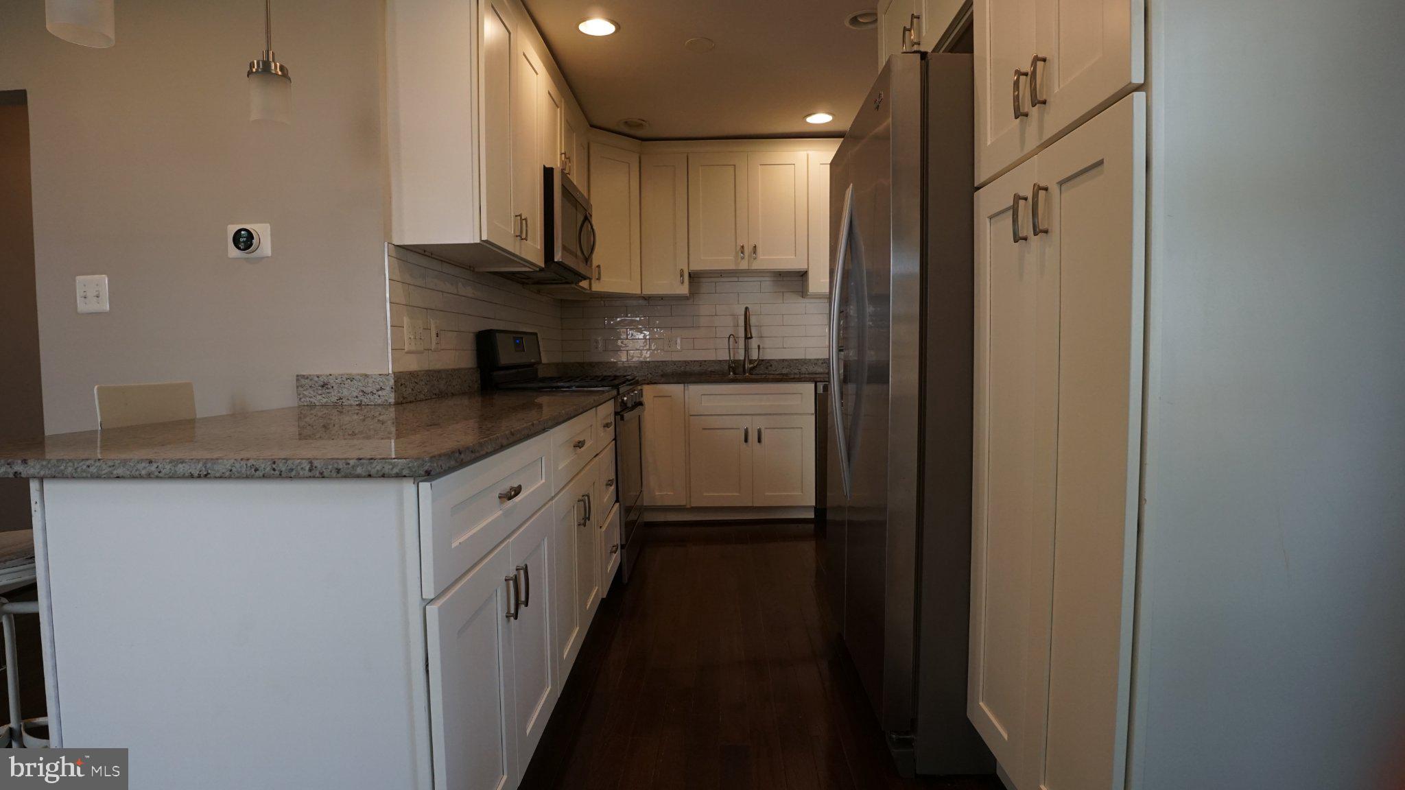 2006 Griffith Road Falls Church, VA 22043 - Photo 5 of 16 Modern kitchen with sleek finishes.