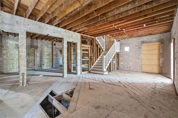 a view of an empty room with stairs