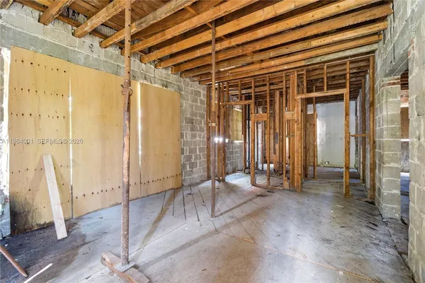 a view of an empty room with glass door
