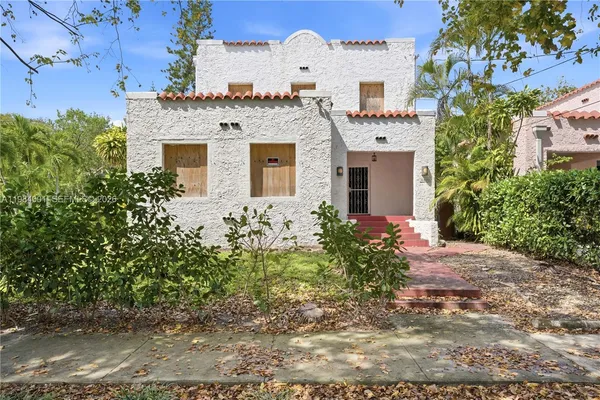 front view of a house with a yard