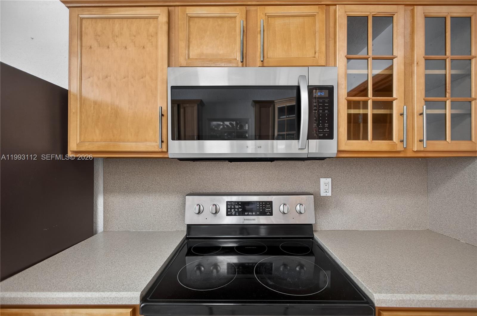 13471 Southwest 99th Terrace Miami, FL 33186 - Photo 41 of 44 a stove top oven sitting inside of a kitchen