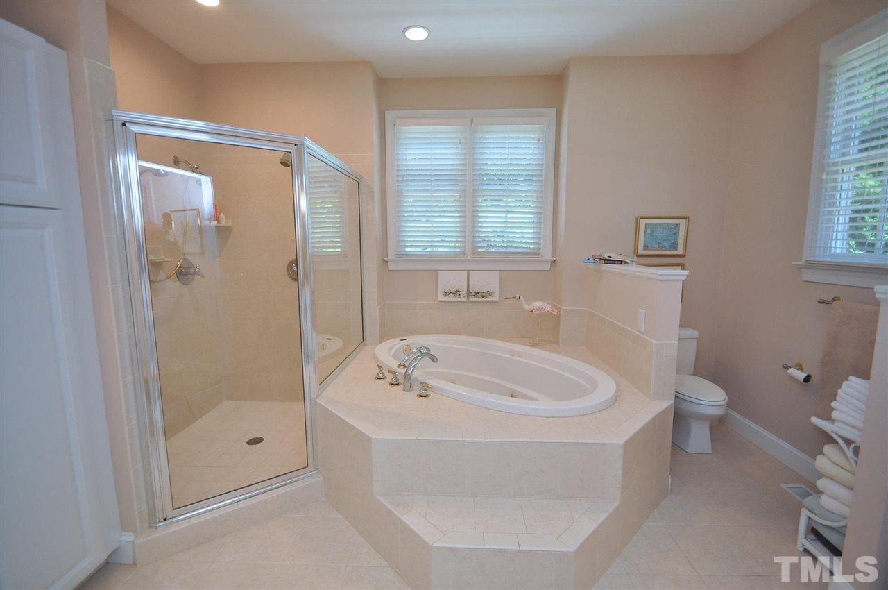 4 Trafalgar Place Durham, NC 27707 - Photo 13 of 27 a bathroom with a tub a toilet and a sink