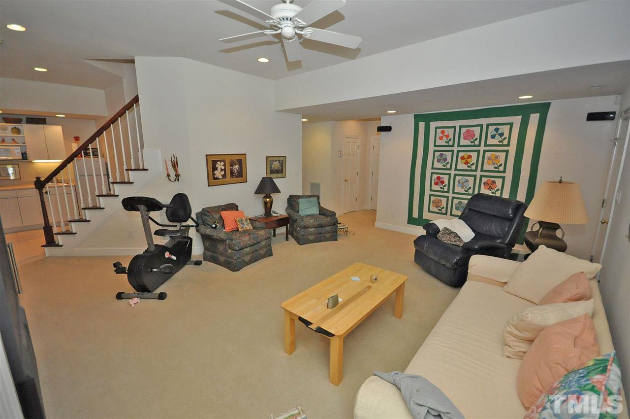 4 Trafalgar Place Durham, NC 27707 - Photo 17 of 27 a living room with furniture gym equipment and a window