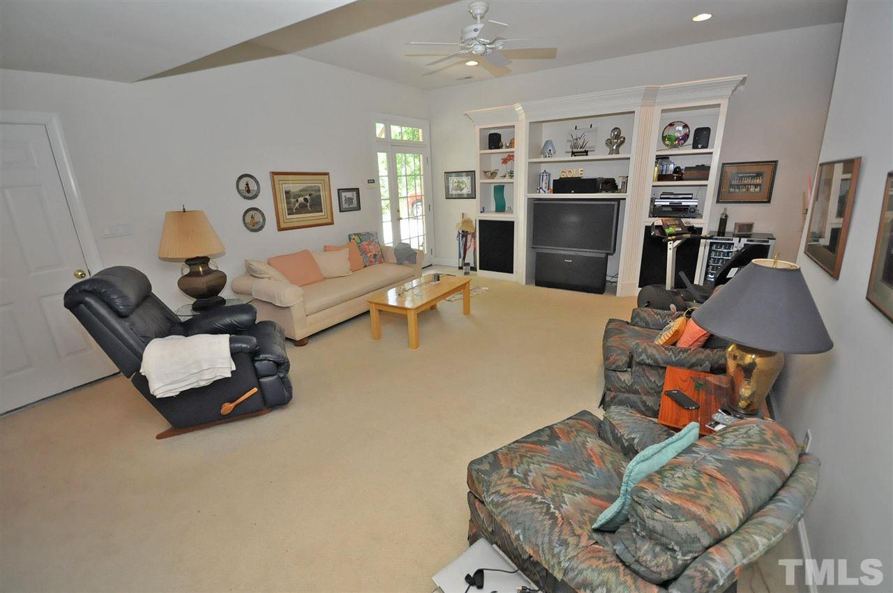 4 Trafalgar Place Durham, NC 27707 - Photo 18 of 27 a living room with furniture and a flat screen tv