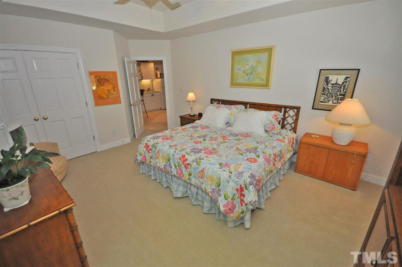 4 Trafalgar Place Durham, NC 27707 - Photo 20 of 27 a bedroom with a bed and dresser