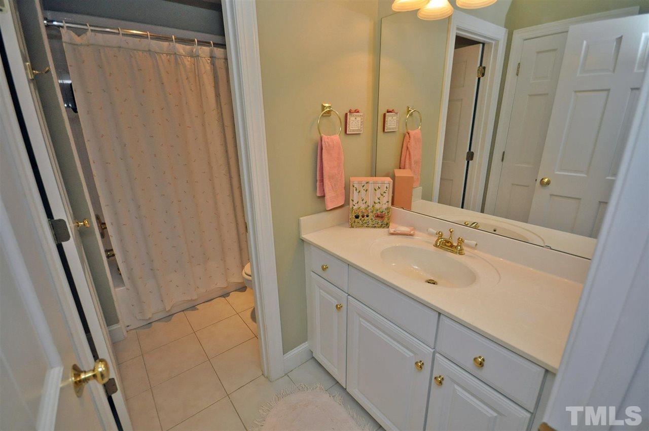4 Trafalgar Place Durham, NC 27707 - Photo 21 of 27 a bathroom with a double vanity sink and mirror