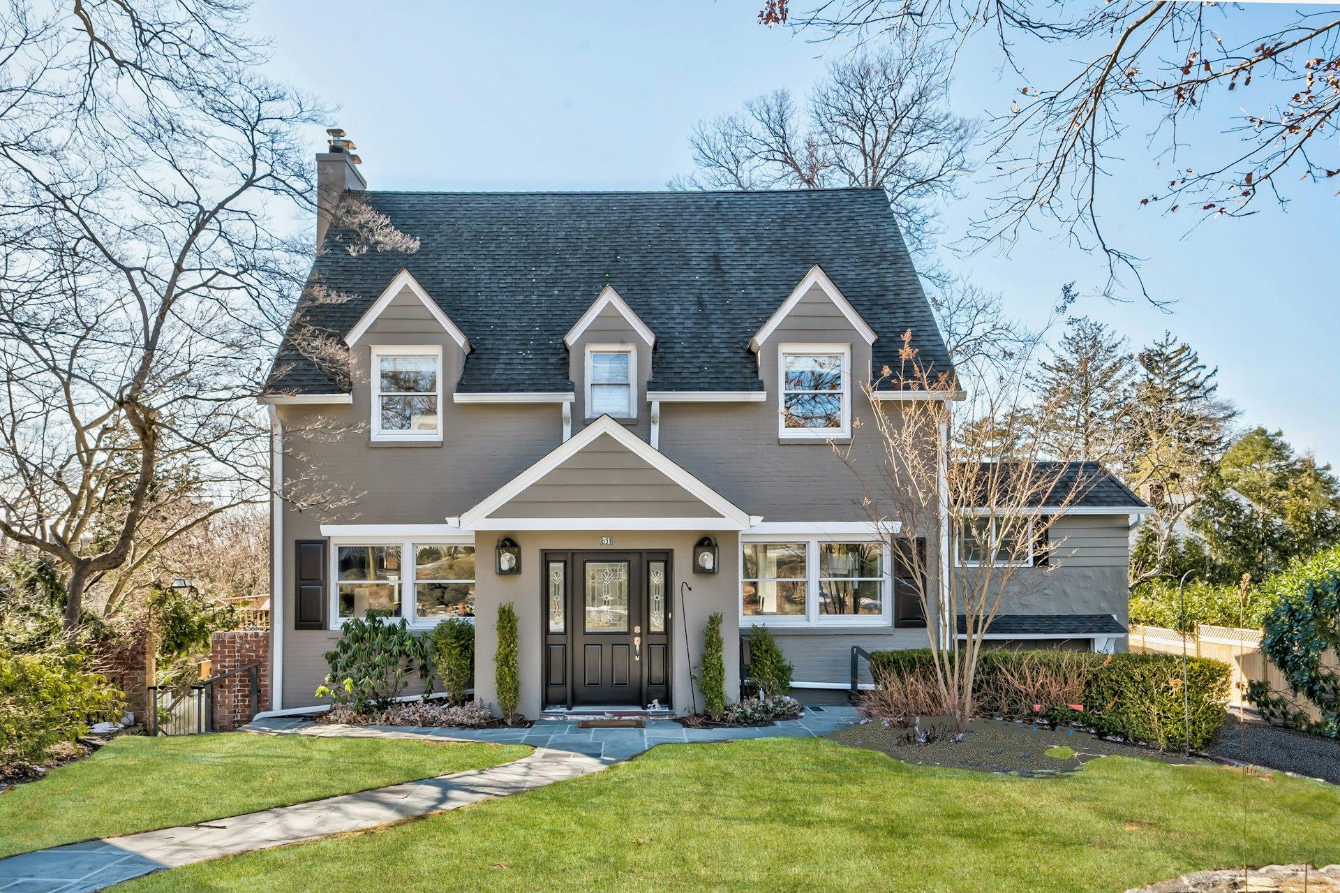 a front view of a house with a yard