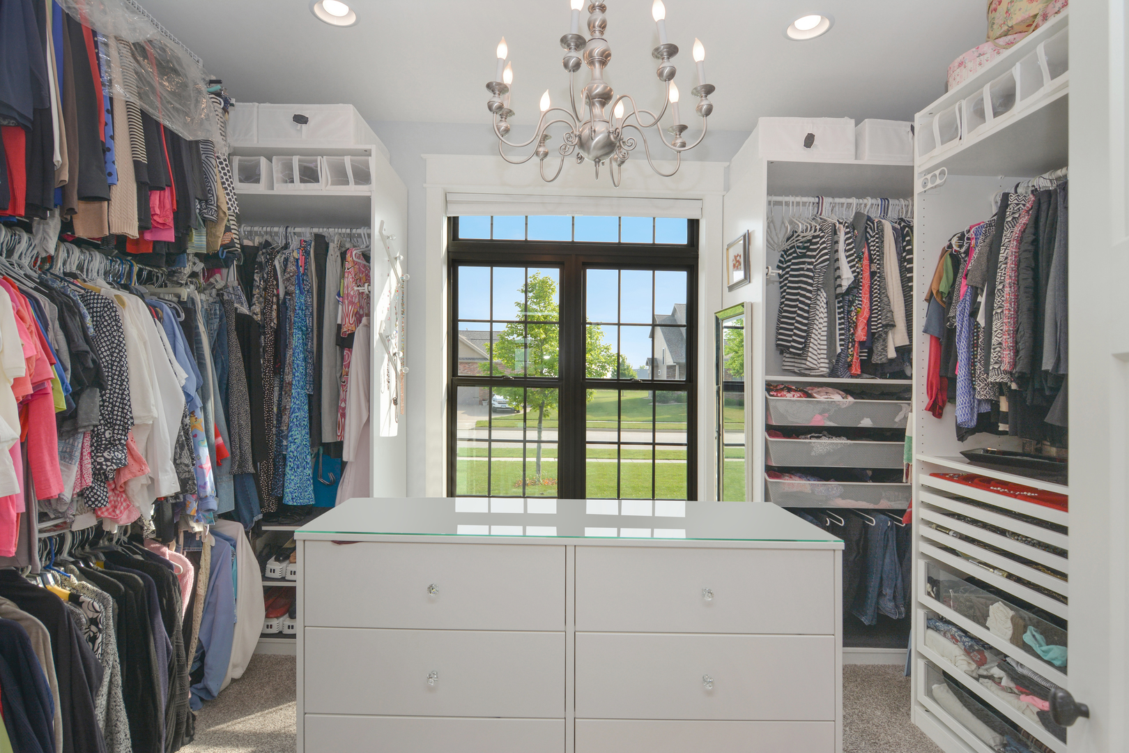 2235 North Bridge Drive Normal, IL 61761 - Photo 35 of 96 a view of walk in closet with clothes and shoes