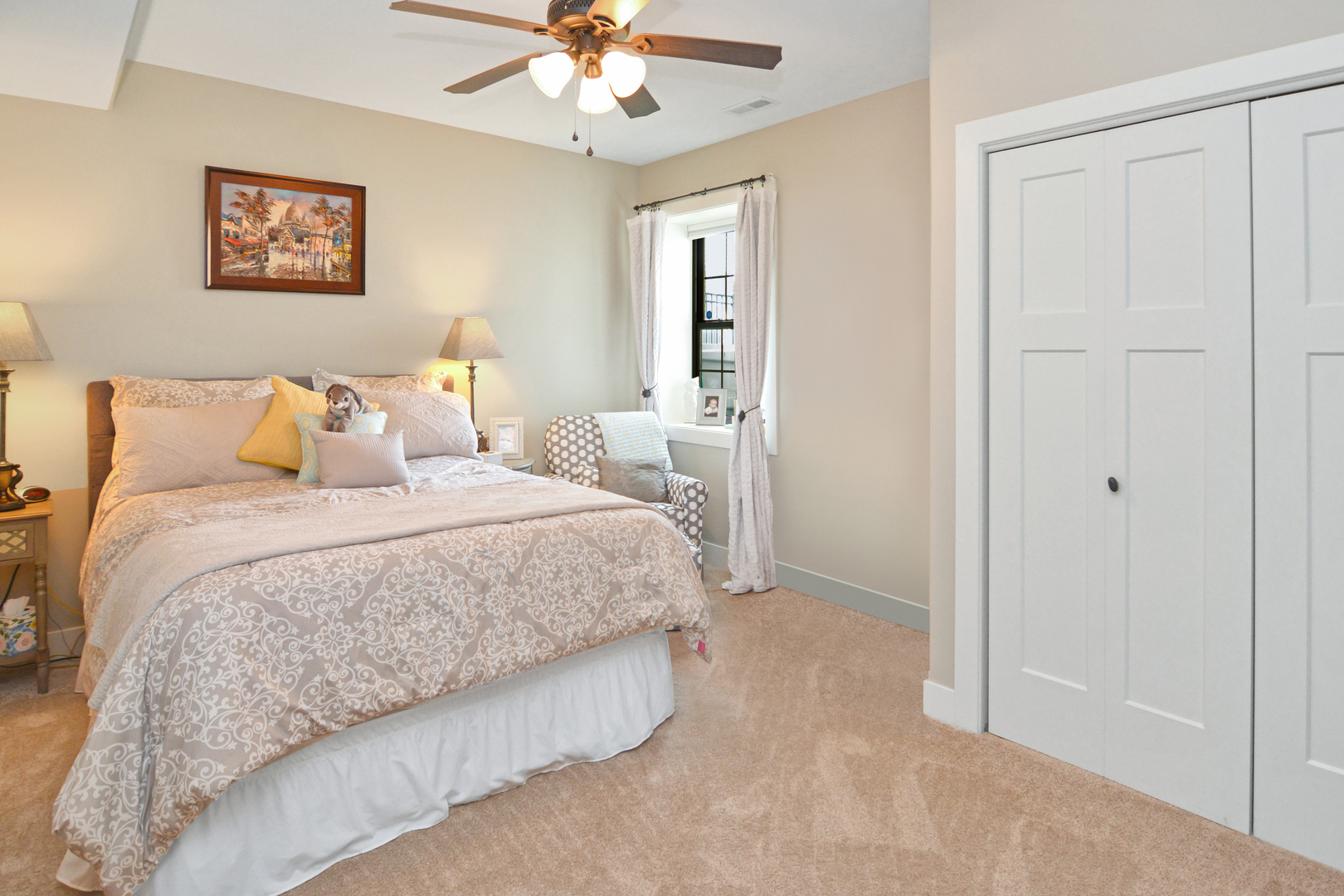 2235 North Bridge Drive Normal, IL 61761 - Photo 52 of 96 a spacious bedroom with a bed and a chandelier